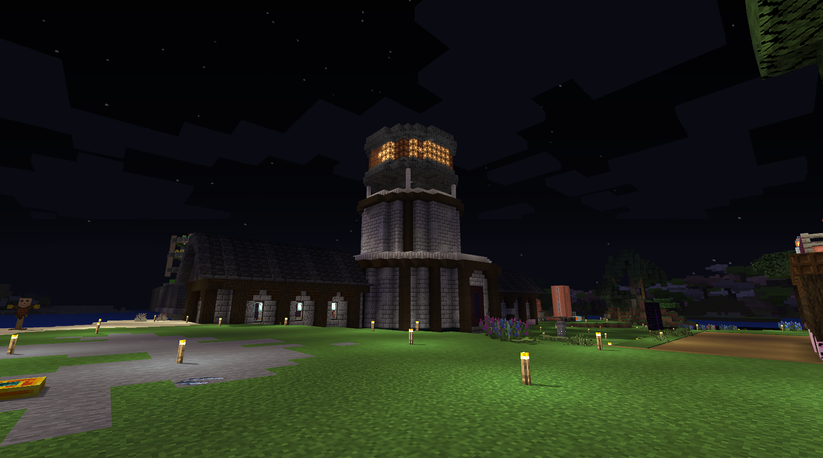 Private NeoForge settlement and illuminated tower at night